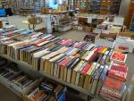 Rows of books on tables and in boxes at book sale