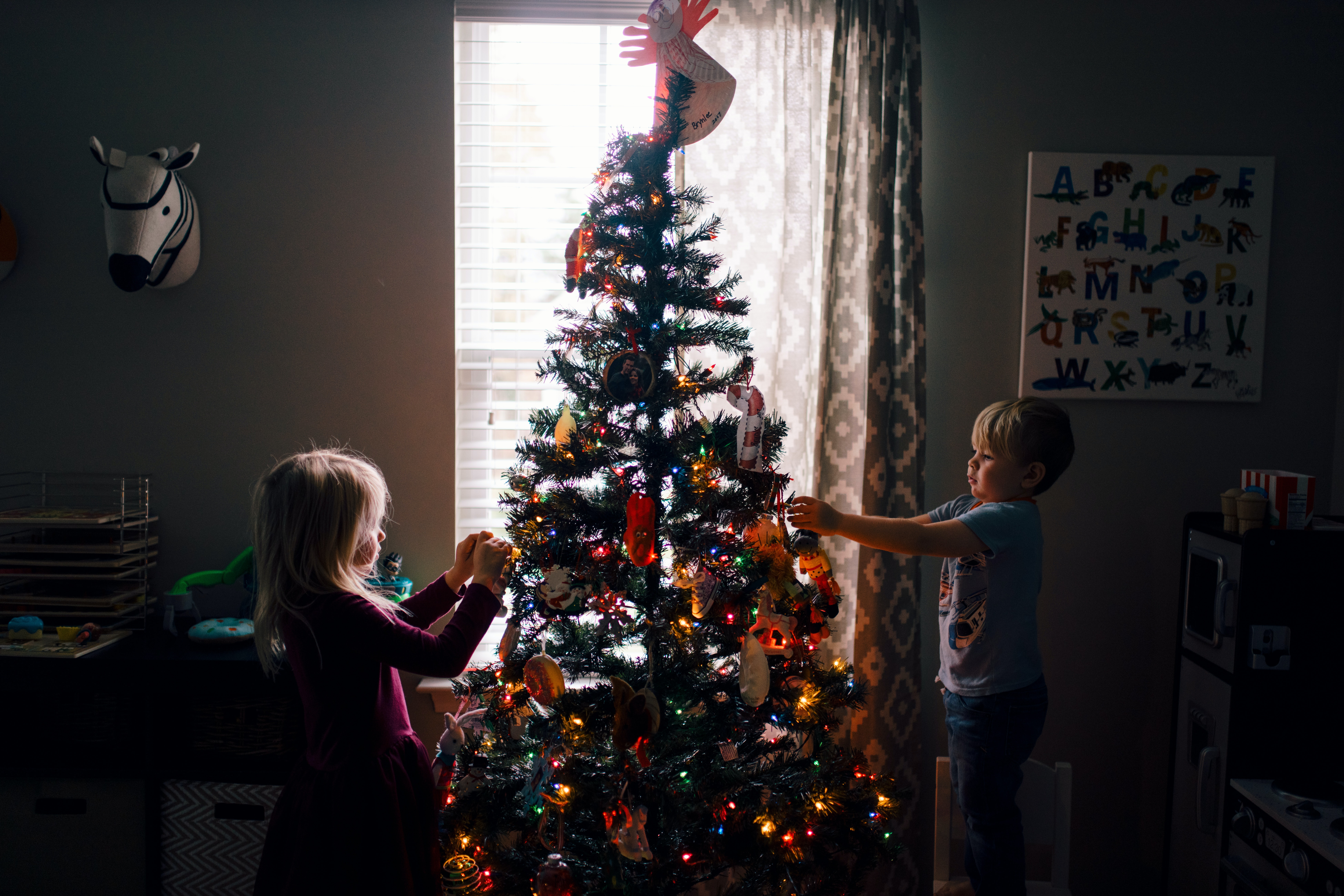 Image of children decorating Christmas Tree