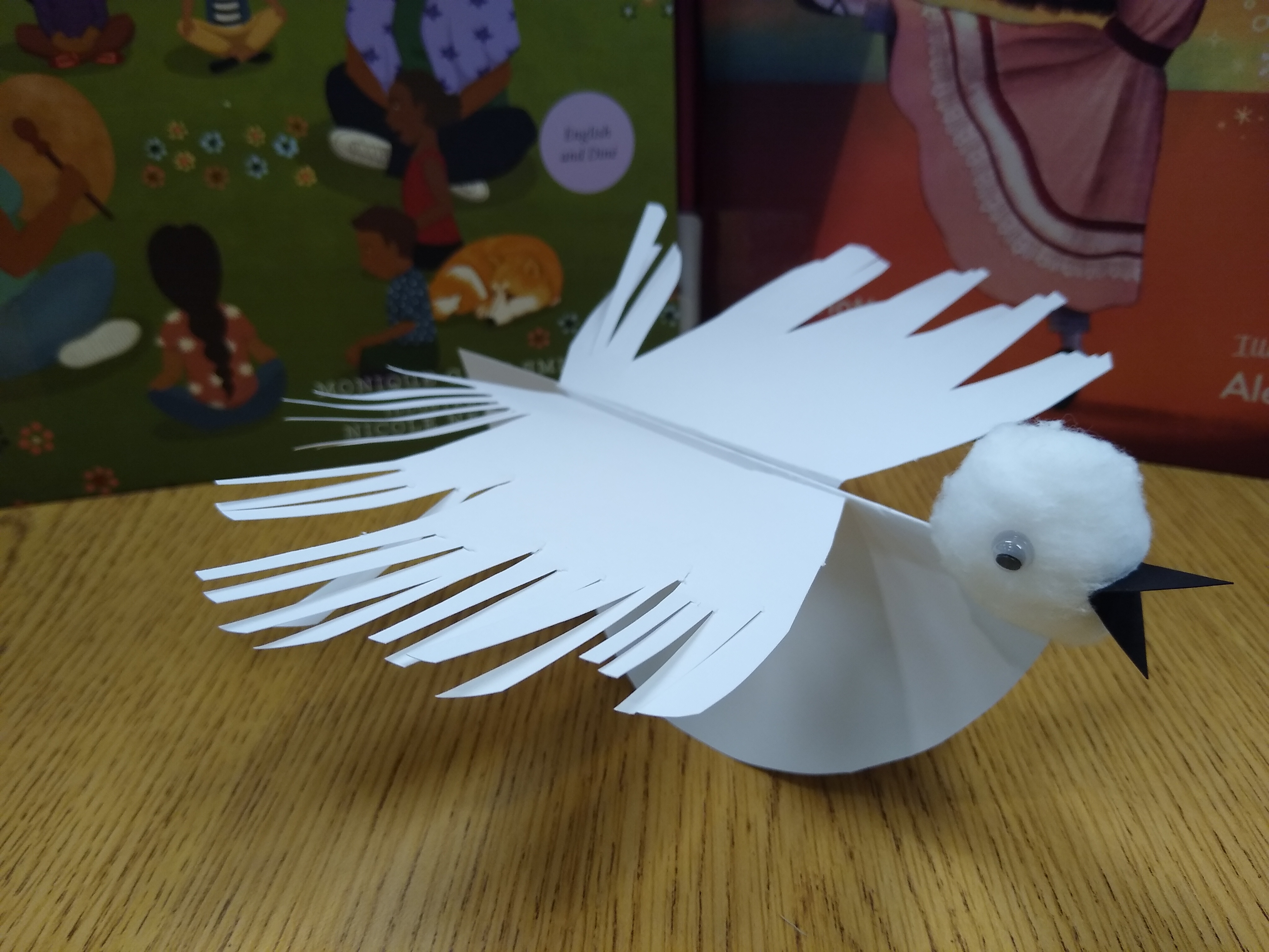 White paper dove made out of cardstock and a cotton ball