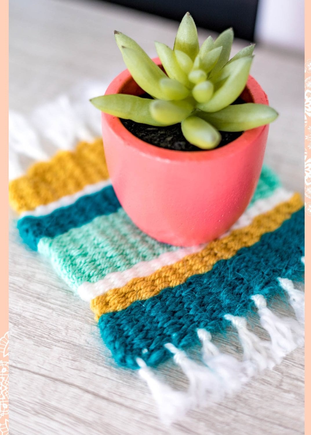 Woven multi-colored mug rug with a plant pot on it