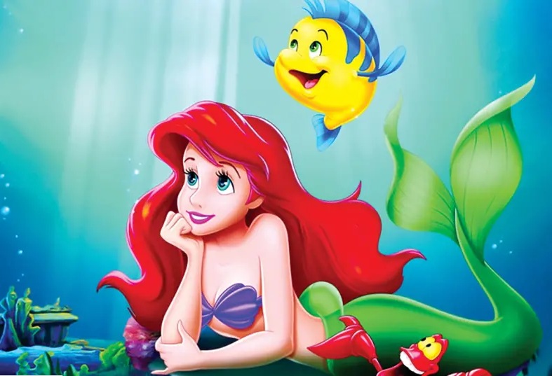 Ariel the mermaid with her sea animal friends. 