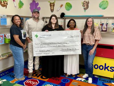 Library Staff and Clearwater Paper Corporation Staff Check Presentation