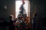 Image of children decorating Christmas tree