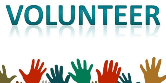 Image of hands raised toward the word volunteer