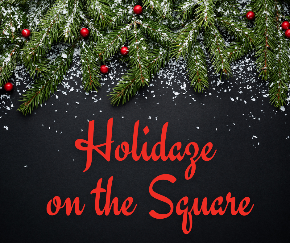 Pine branches and holly berries and the words Holidaze on the Square